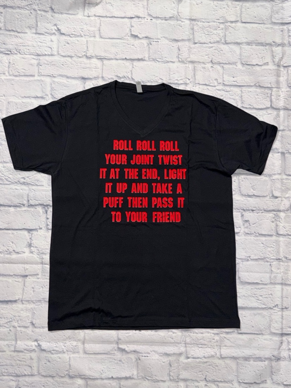 Black V‑Neck Graphic Tee with Bold Red Graphic